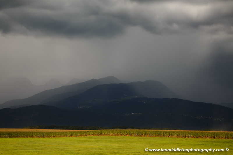 View of Krvavec mountain and ski resort (1854m) and the Kamnik Alps as storm clouds pass over in Slovenia