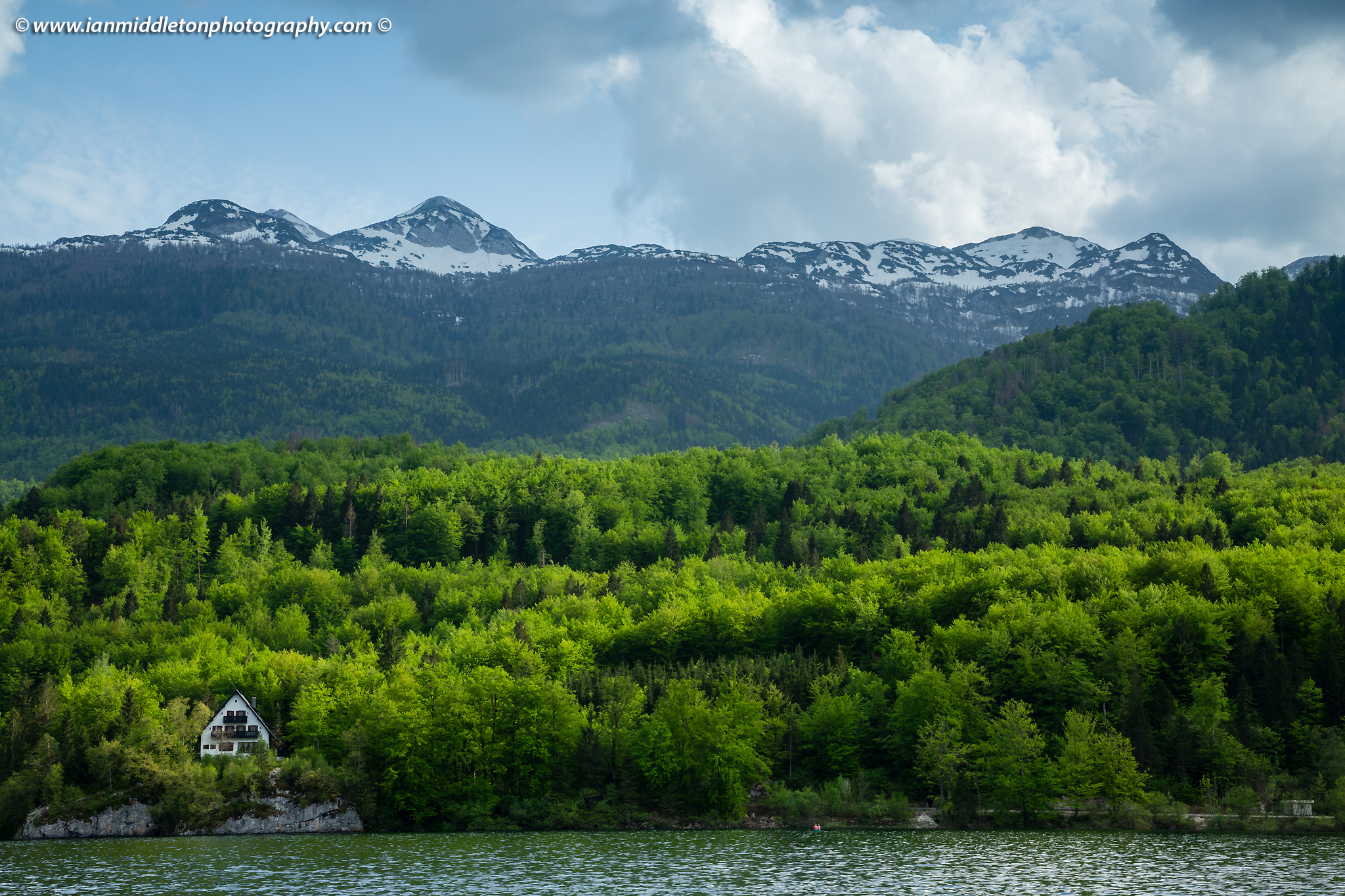 Late Spring greens at Lake Bohinj, Triglav National Park, Slovenia. View across the lake to POČITNIŠKI DOM NA SKALCI, MNZ - Ministrstvo za notranje zadeve RS