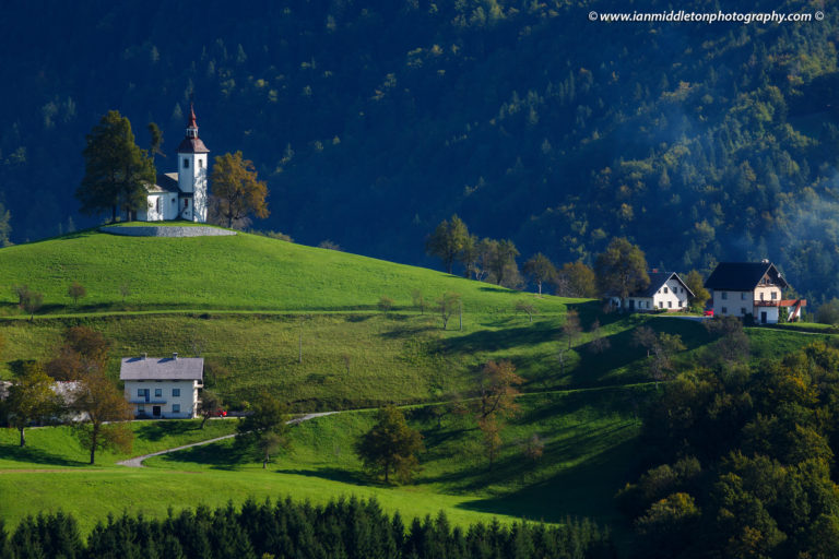 View from Rantovše hill across to Sveti Tomaz nad Praprotnim (church of Saint Thomas) in the Skofja Loka hills, Slovenia.