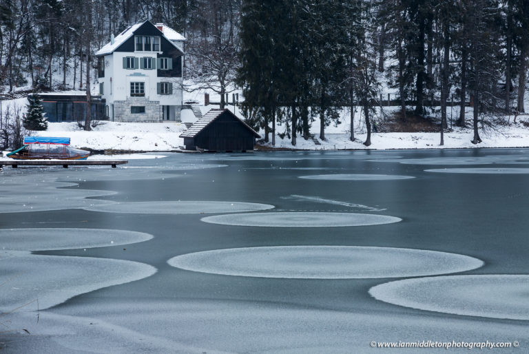 View across frozen Lake Bled, Slovenia. The western side of the lake is slightly frozen after the Siberian storm brought freezing temperatures across Europe late February.