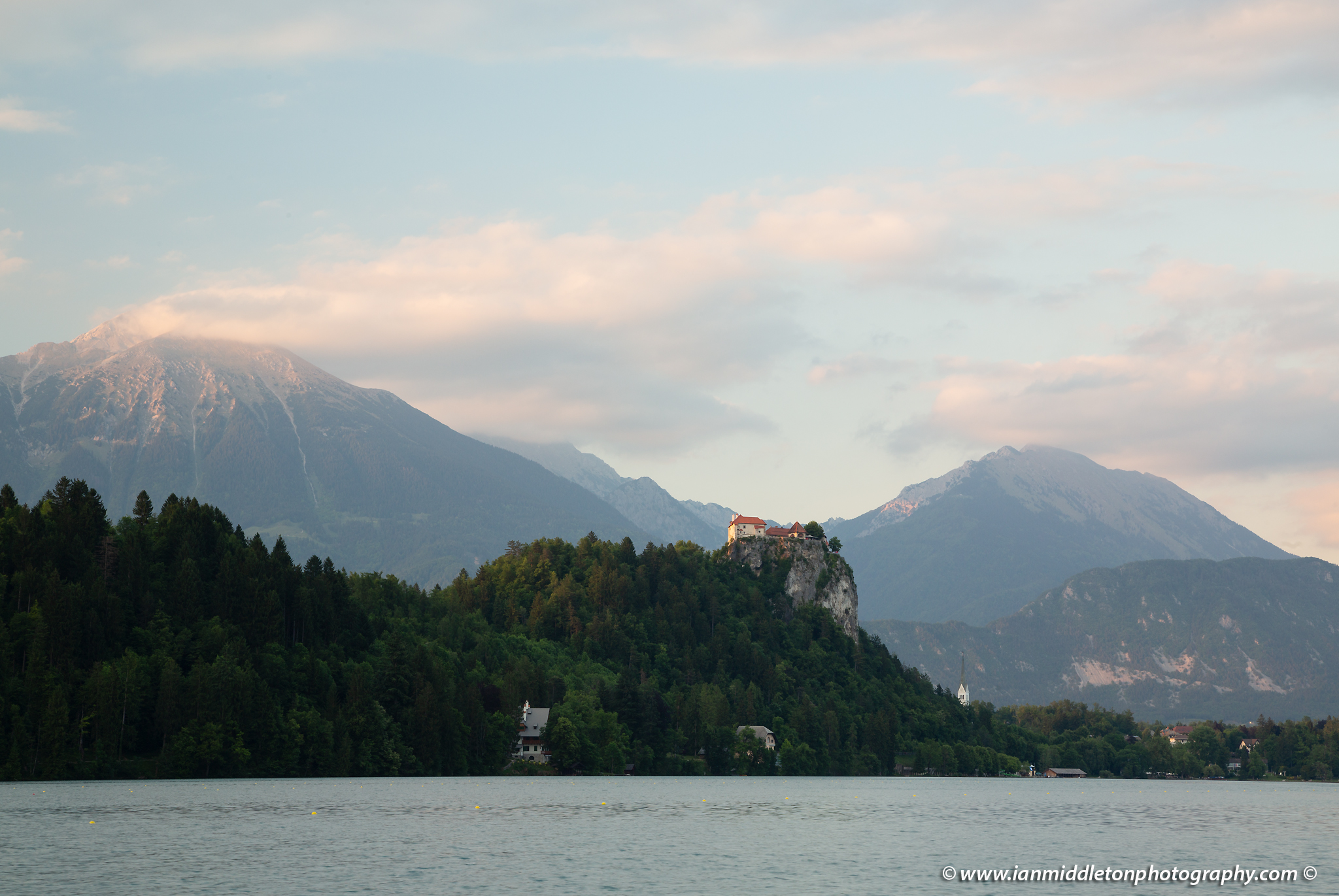 Beautiful light across the beautiful Lake Bled's hilltop castle and Mount Stol, the highest peak in the Karavank Mountains. Slovenia. - unedited version