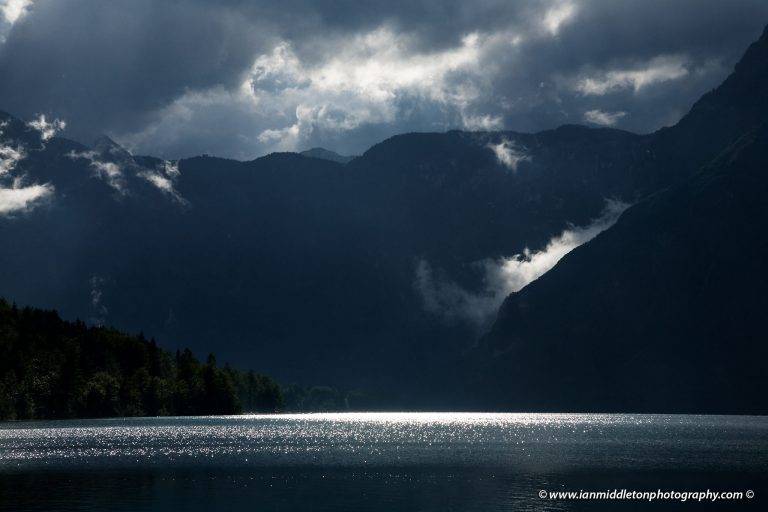 Beautiful light and clouds scattering over Bohinj Lake after a massive storm blew over the Bohinj valley, Triglav National Park, Slovenia.