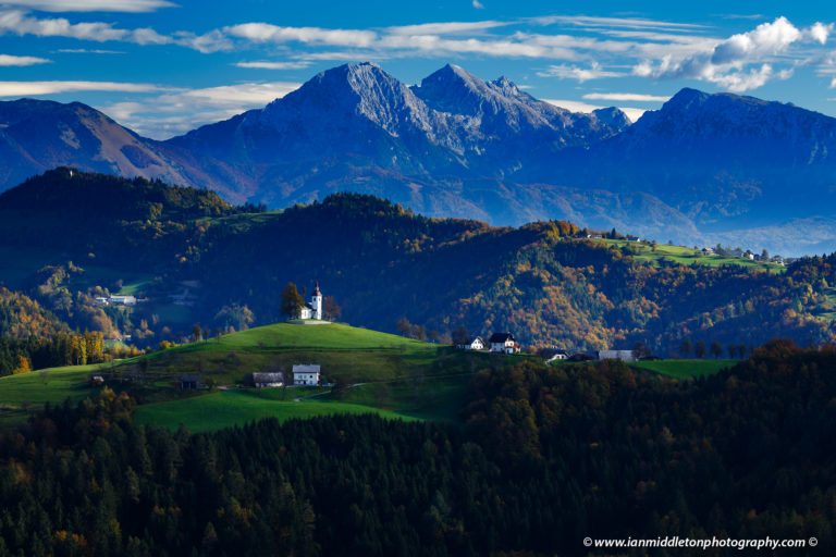 View from Rantovše hill across to Sveti Tomaz nad Praprotnim (church of Saint Thomas) in the Skofja Loka hills, Slovenia.