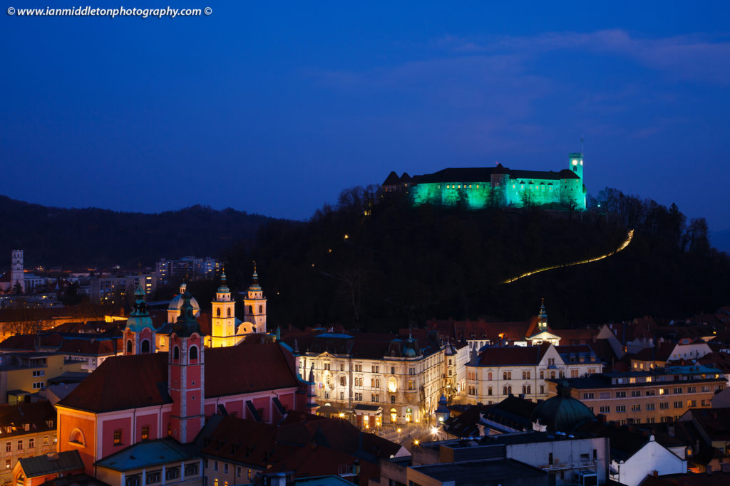 Looking down to the city centre of Ljubljana with the Ljubljana Castle lit up green to celebrate its status as European Green Capital 2016, Slovenia