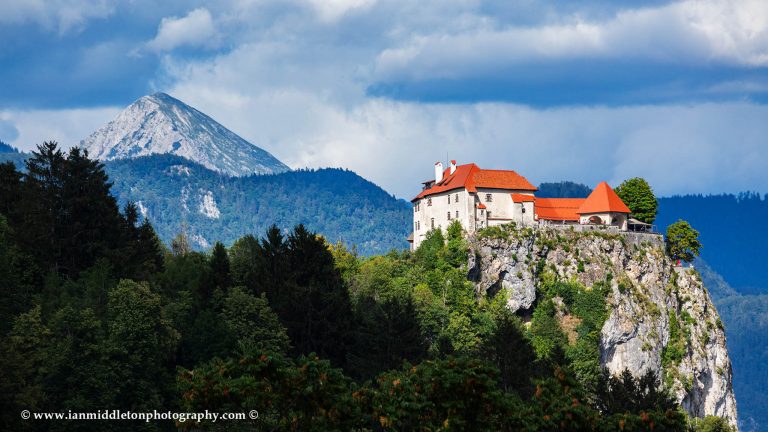 A different view of Lake Bled's hilltop castle and Mount Begunjščica, one of the peaks of the Karavanke Mountains. Slovenia.