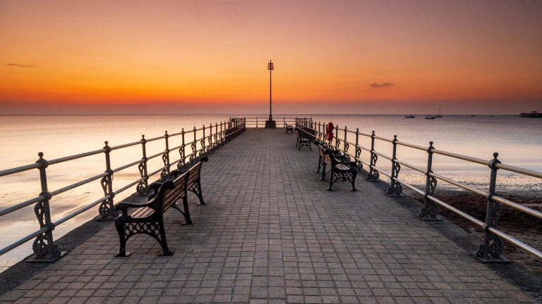 The old cobbled Banjo Jetty at sunrise in Swanage, Dorset, England.