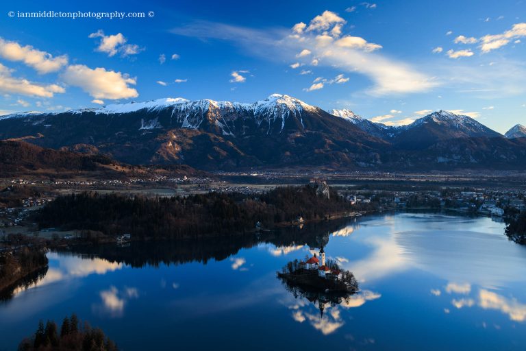 Lake Bled to the island church and clifftop castle from Mala Osojnica, Slovenia.