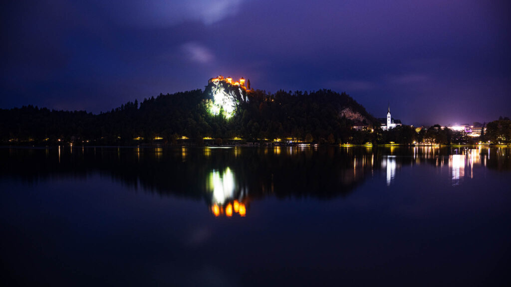 Lake Bled castle and church of Saint Martin at night, Slovenia.
