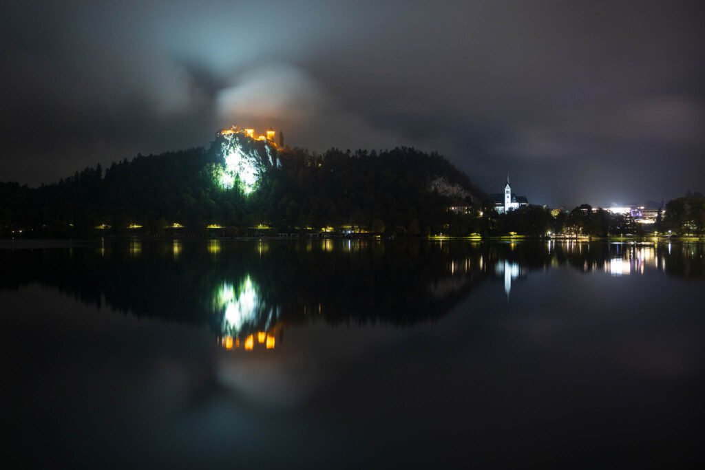 Lake Bled castle and church of Saint Martin at night, Slovenia.
