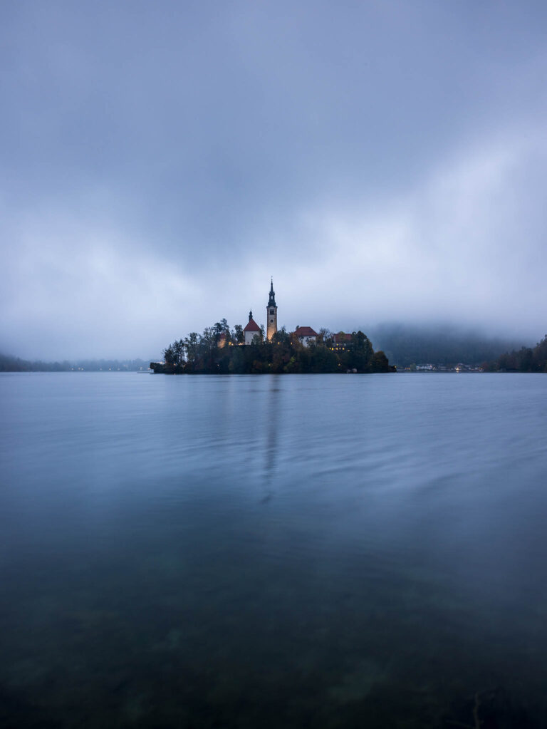 Rainy morning at Lake Bled's island church of the assumption of saint mary, Slovenia.